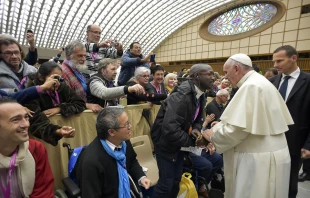 A man identified by the French newspaper La Croix as Emmanuel Abayisenga greets Pope Francis at the Vatican on Nov. 11, 2016. Vatican Media.